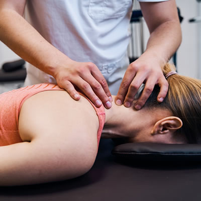 woman on therapy back of neck