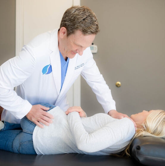 Schultz Chiropractic & Acupuncture patient having back adjusted