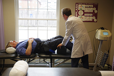 Dr. Schultz doing spinal decompression on patient