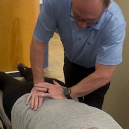 person having back adjusted