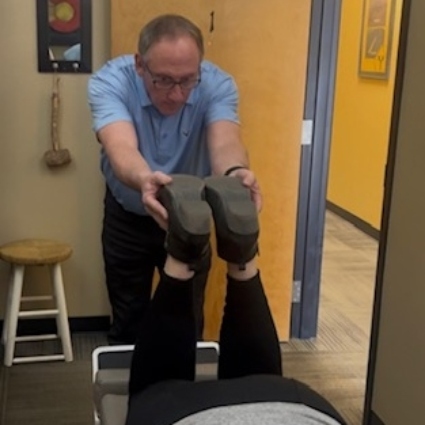 Palmer Chiropractic patient having feet adjusted