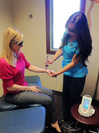 Patient receiving Laser Therapy on their wrist