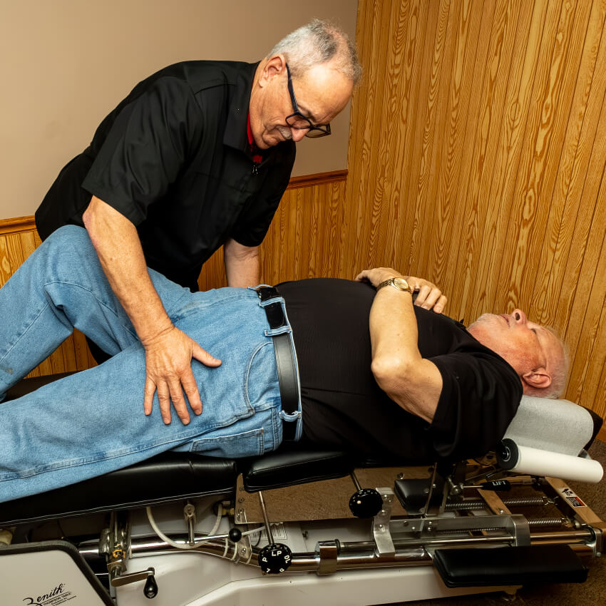Dr D adjusting patients hips