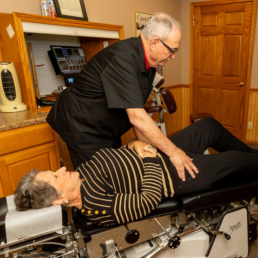 Dr D adjusting patients leg