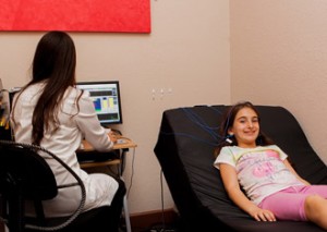 girl receiving biofeedback treatment