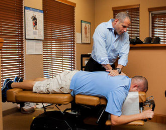 Dr. Joe adjusting at Parkside Health & Wellness Center