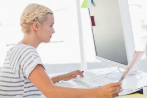 woman focusing on her computer