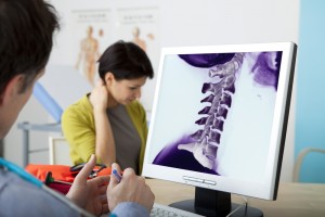 doctor reviewing neck x-ray
