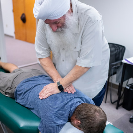 chiropractor adjusting back