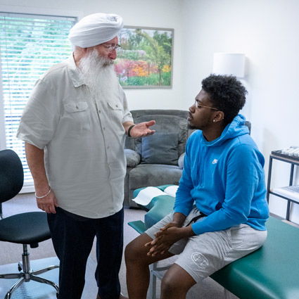 Dr. Khalsa speaking with a patient