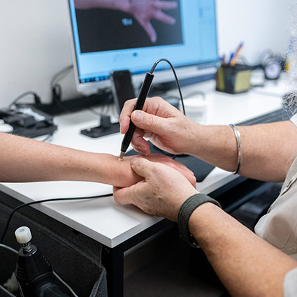 scan being done on patients wrist