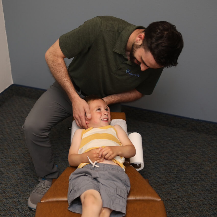 kid having neck adjusted