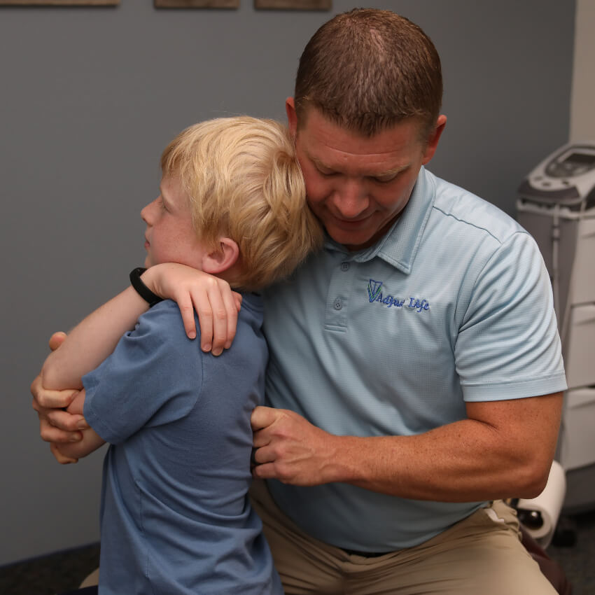 kid having back adjusted
