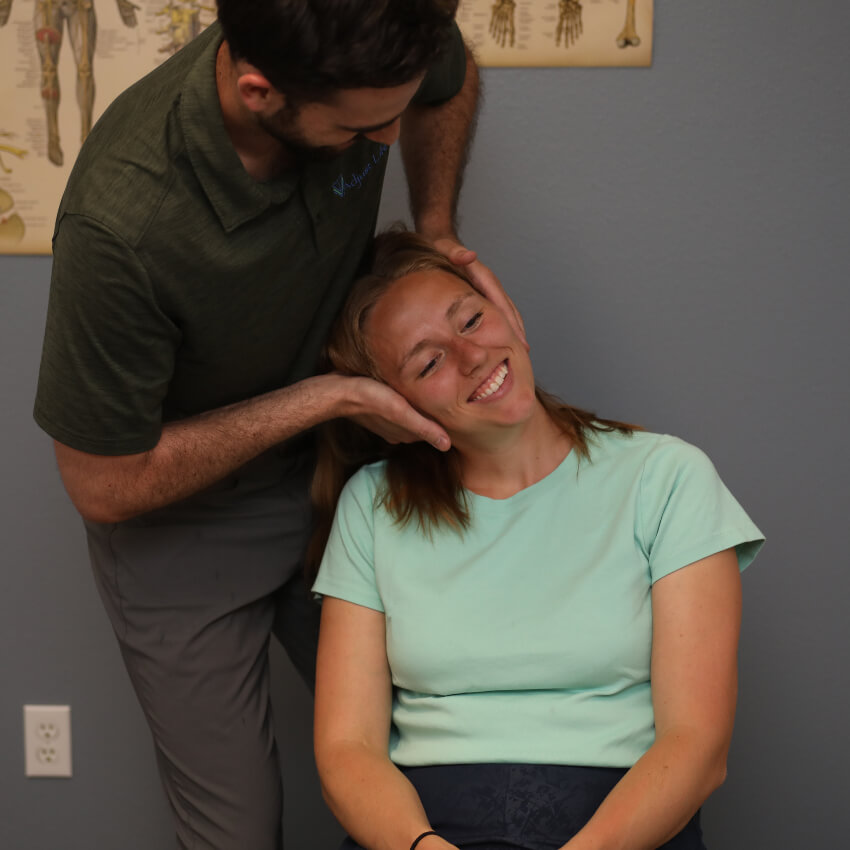 patient having neck adjusted