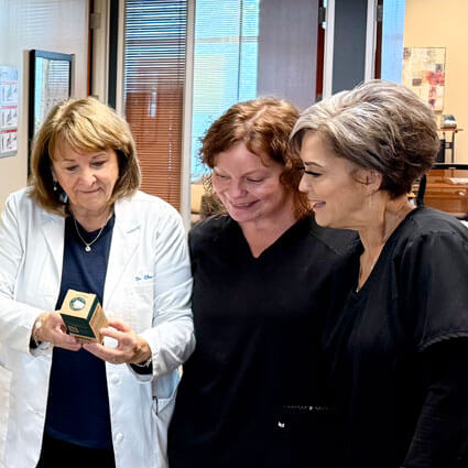 team looking at product