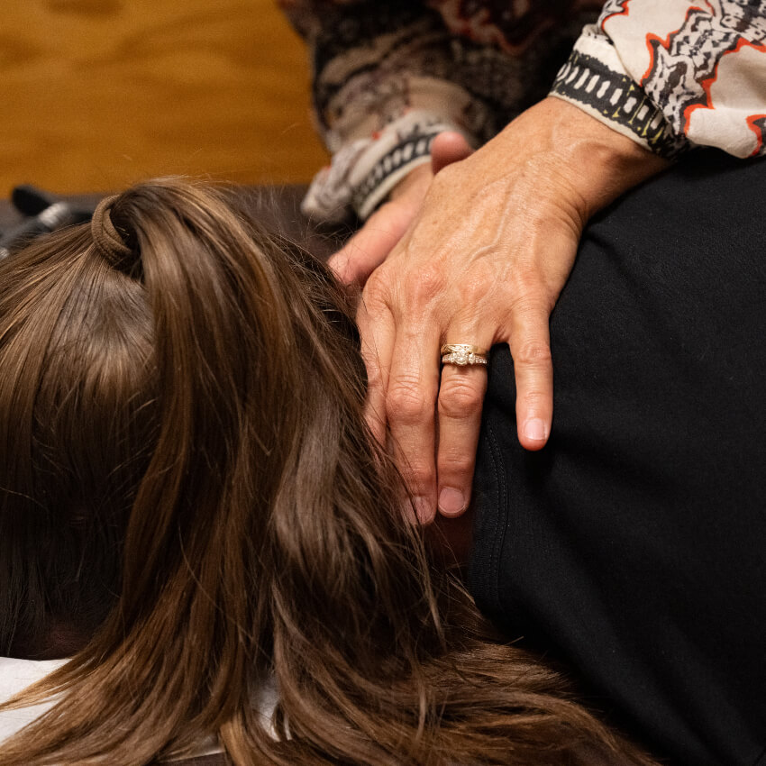 Dr K adjusting patients shoulders