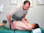 Dr. Scott adjusts a patient.