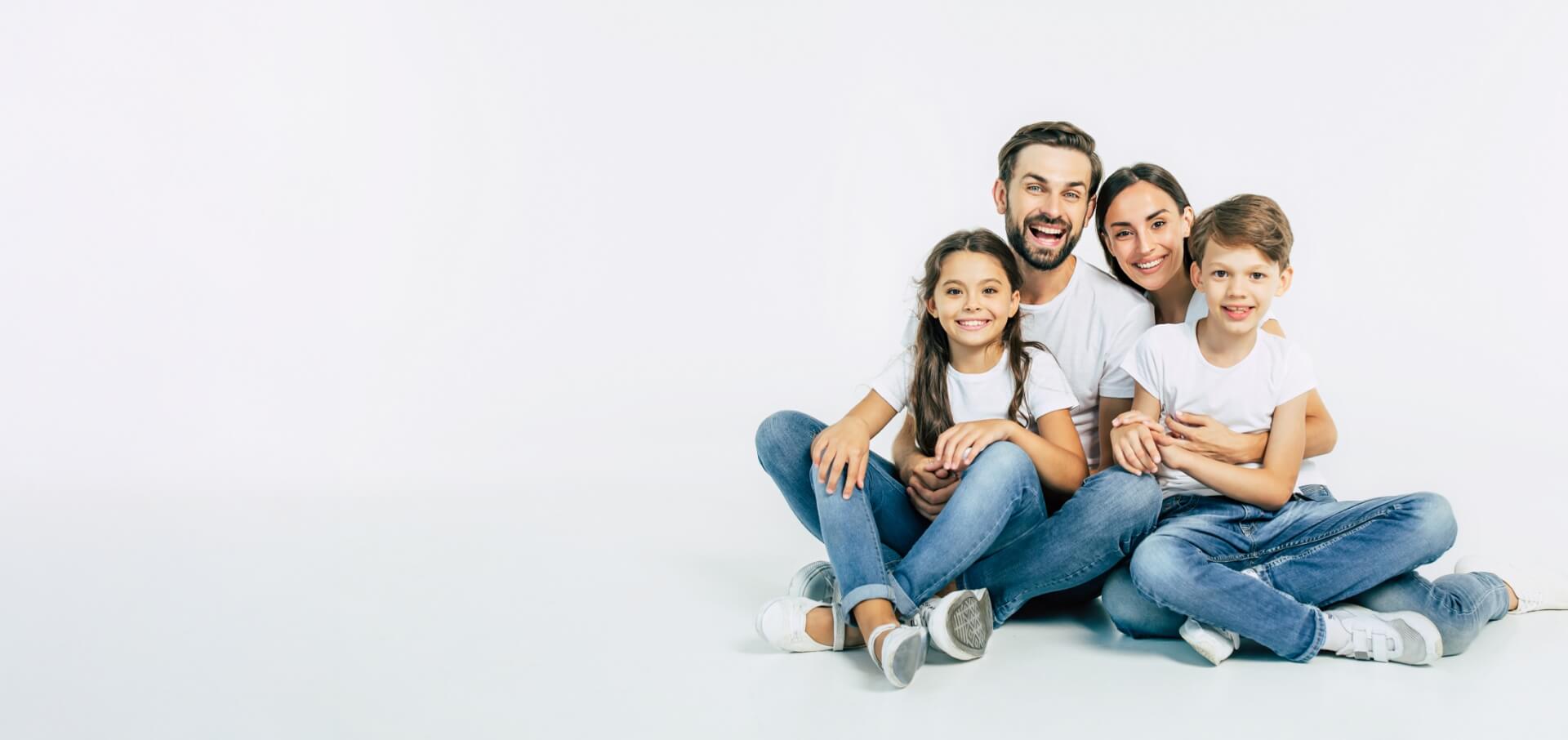 family of four smiling
