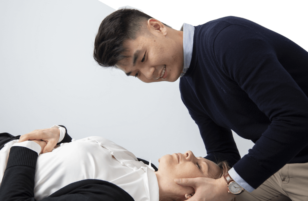 Doctor adjusting patient's neck