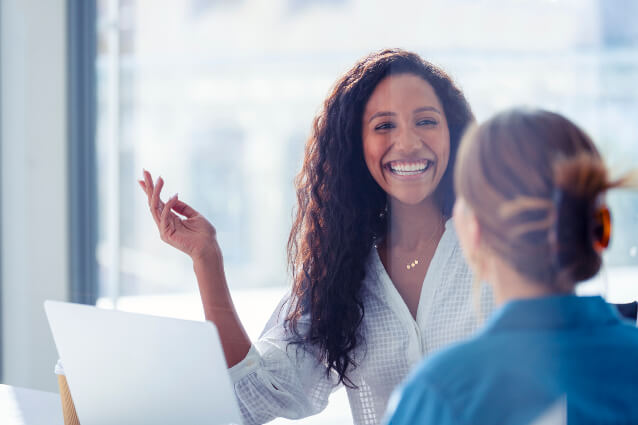 smiling person walking in to office