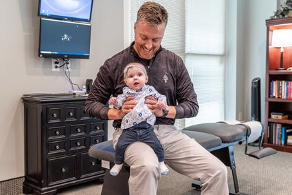 Dr. Matt holding baby