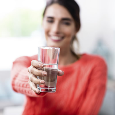 Woman holding a glass of water