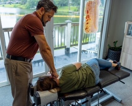 Female patient neck adjustment