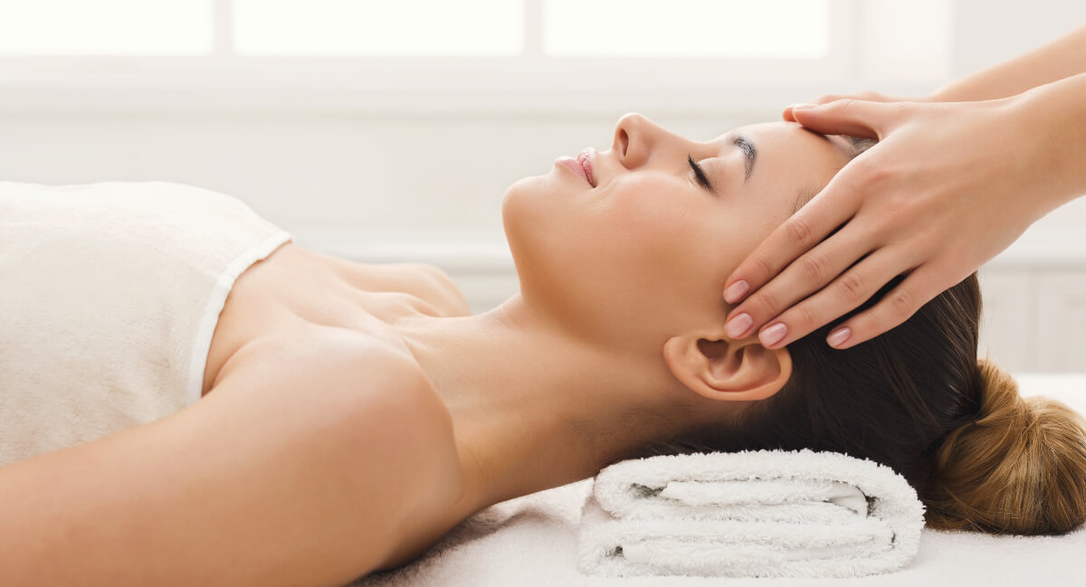 Female patient receiving a head massage