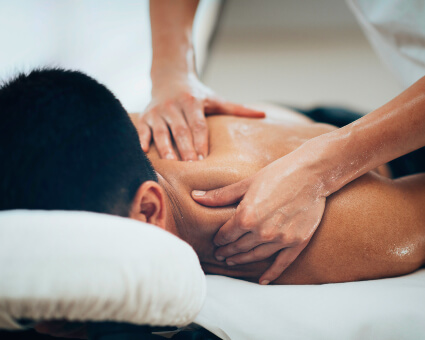 Male patient receiving a shoulder massage