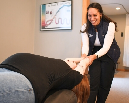 Dr. Simpson adjusting a pregnant lady