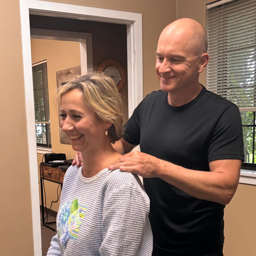 Dr RIch adjusting patients shoulders