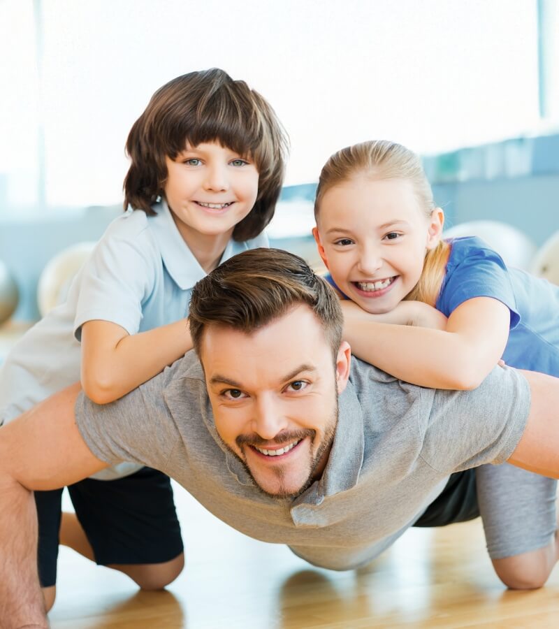 dad and 2 kids playing together