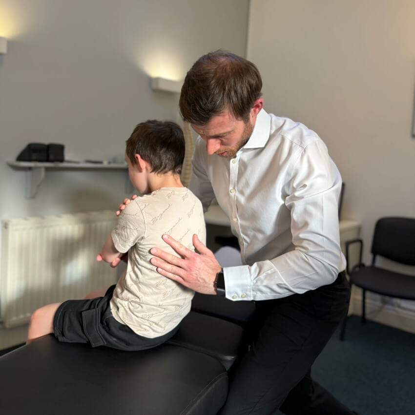 child patient having back adjusted