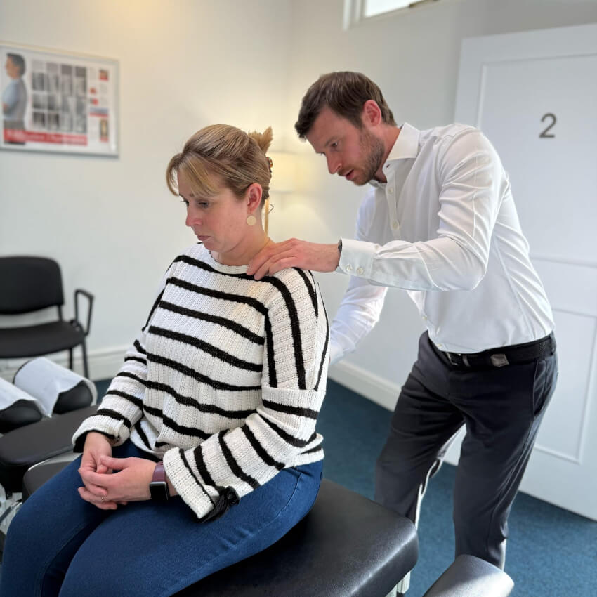 Dr Manning adjusting patients neck