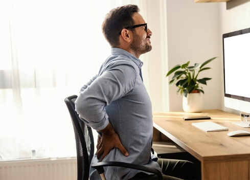 Young professional with back pain