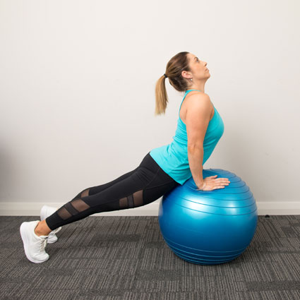 Woman using exercise ball