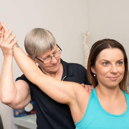 pressing on shoulder