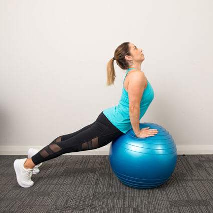 woman stretching on ball