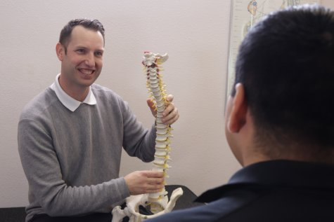 Dr. Rhodes showing spine model