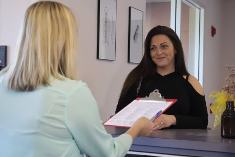 Woman at reception desk