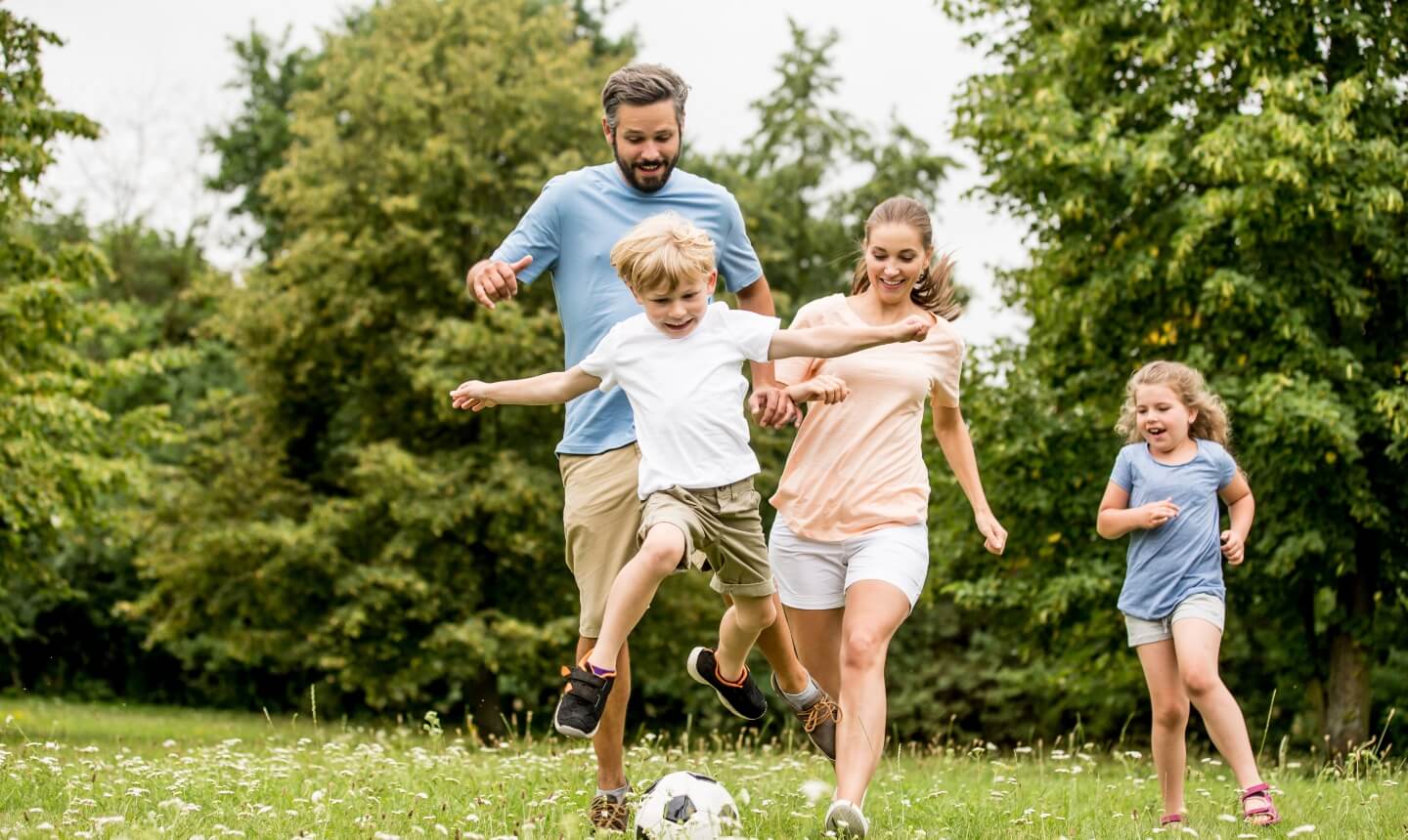 family playing soccer