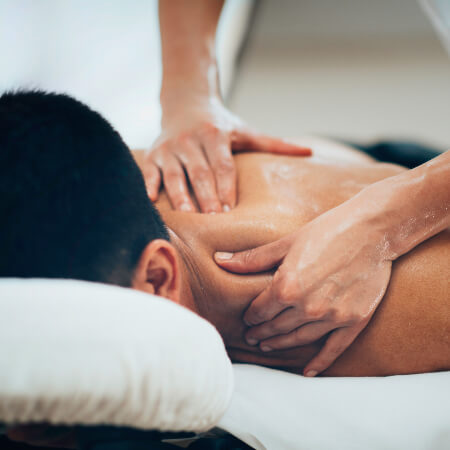 Male patient receiving a shoulder massage