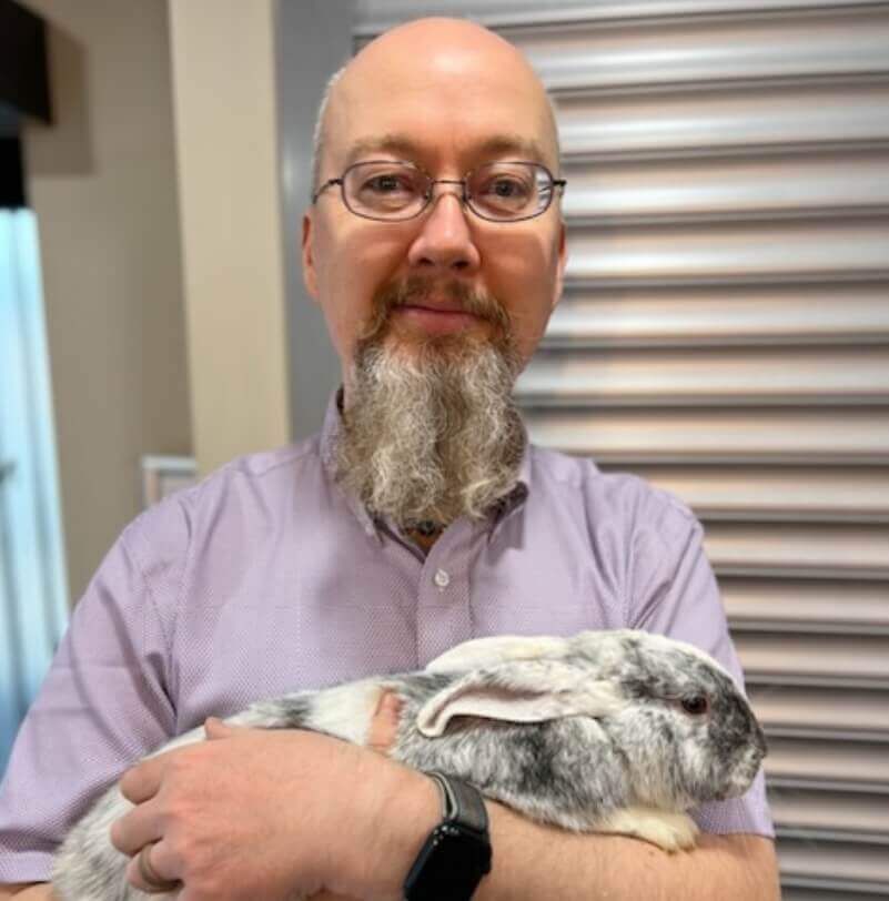 50th Street Chiropractic Chiropractor Dr. Garda holding bunny