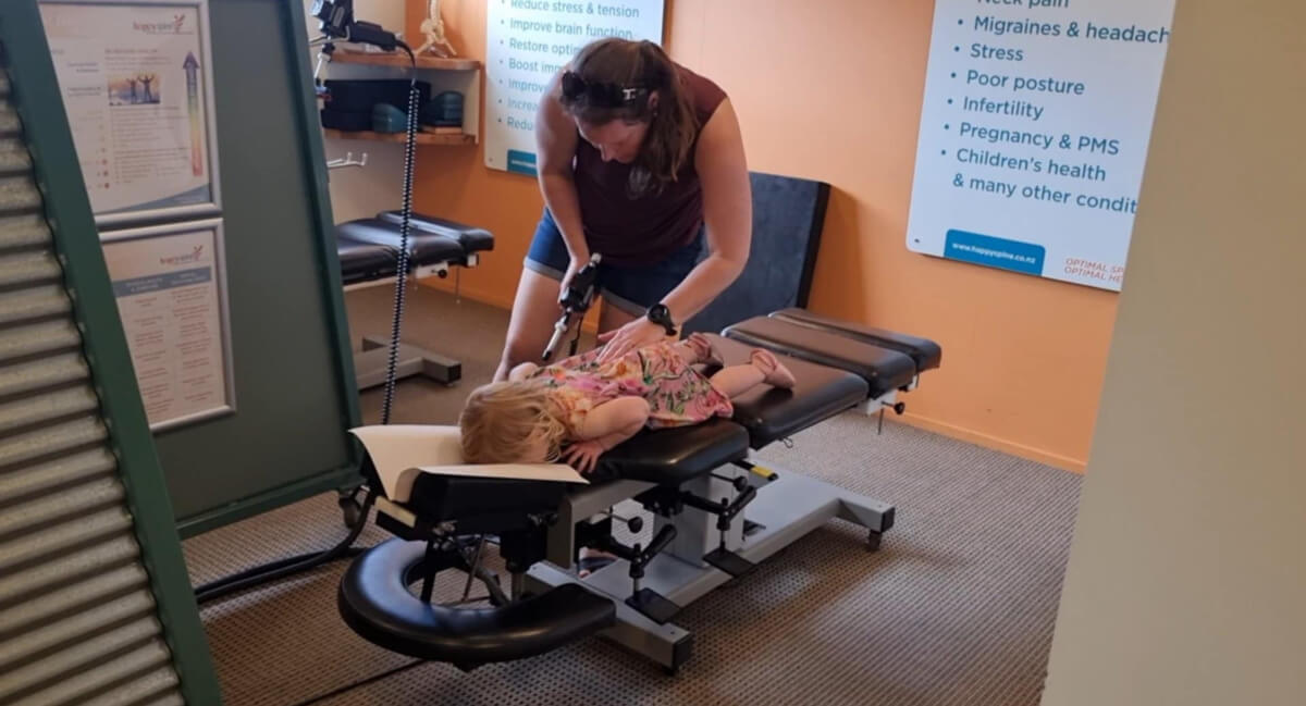 Female pediatric patient getting adjusted