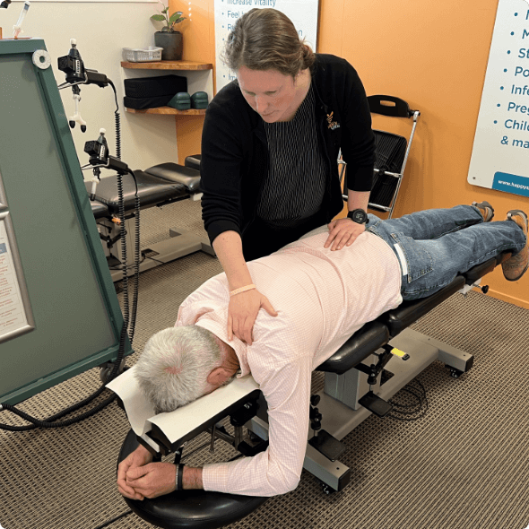 Christchurch chiropractor Dr Kim adjusting male patient