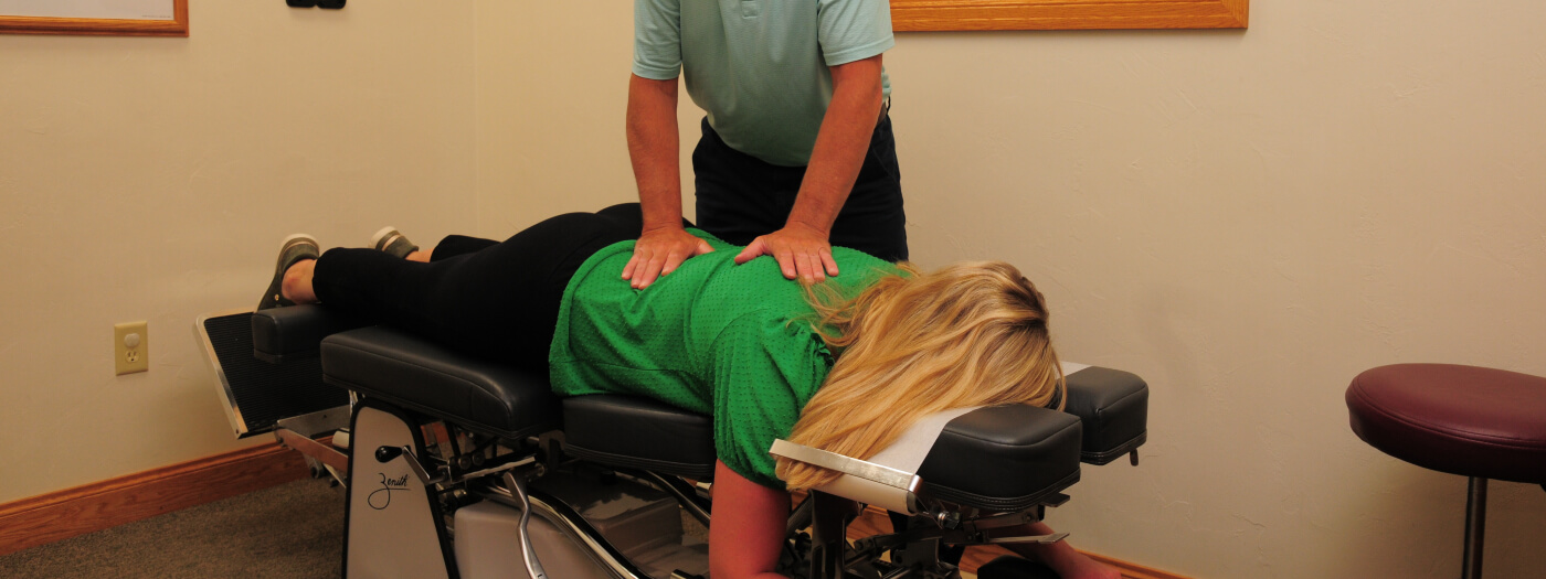 Marinette chiropractor adjusting a female patient