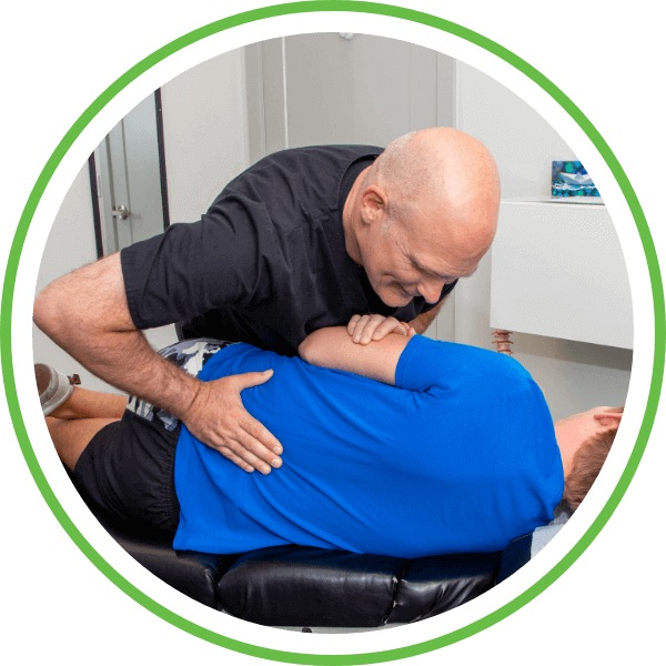 Male patient lower-back adjustment