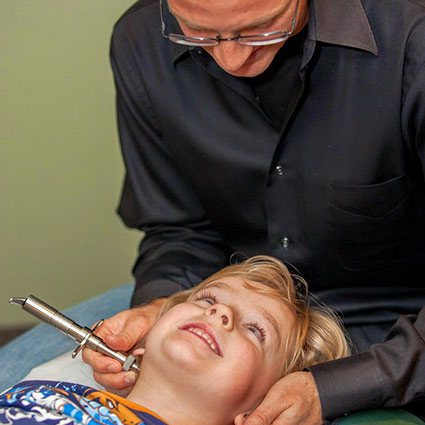 Dr David adjusting a patient