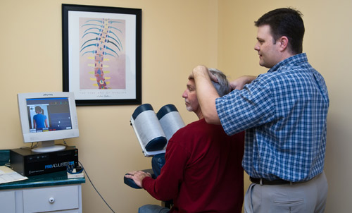 Dr. Corfman uses the Pro-Adjuster on a patient.