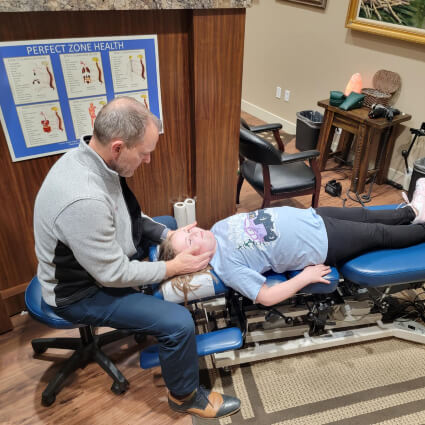 Child getting neck adjustment